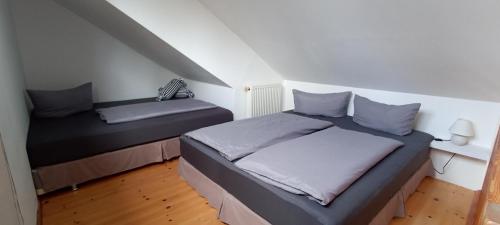 a bedroom with two beds in a attic at Juliusruh Strandparadies 6 in Juliusruh