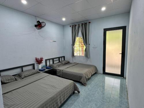 Postel nebo postele na pokoji v ubytování Nhà nghỉ Thu Bông - Thu Bong motel