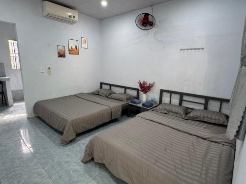 Postel nebo postele na pokoji v ubytování Nhà nghỉ Thu Bông - Thu Bong motel