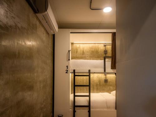 Ένα ή περισσότερα κρεβάτια σε δωμάτιο στο Lanna Loft Hostel