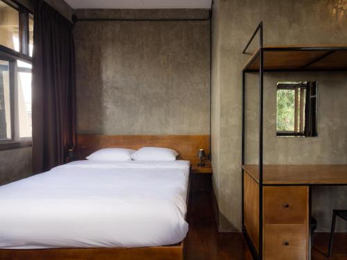 Ένα ή περισσότερα κρεβάτια σε δωμάτιο στο Lanna Loft Hostel