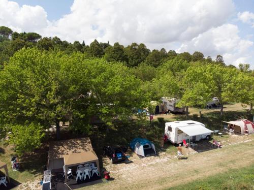 an aerial view of a campground with tents and trees at Camping Village Mar y Sierra in San Costanzo