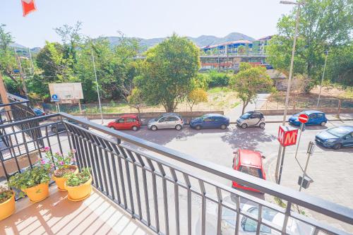 a balcony with cars parked in a parking lot at Sirio Guest House in Salerno