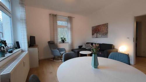 a living room with a table and chairs and a living room at Bergapartment in Königstein an der Elbe