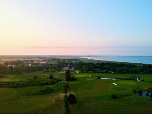 an aerial view of a golf course with the ocean at Seaside Escape in Ho Bay - By Traum Ferienwohnungen in Ho
