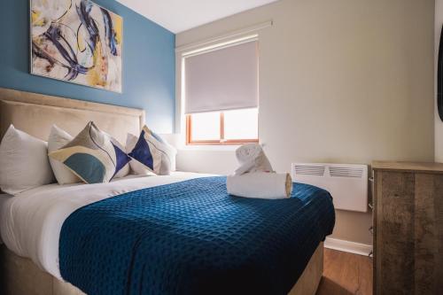 Ένα ή περισσότερα κρεβάτια σε δωμάτιο στο Coat Apartment