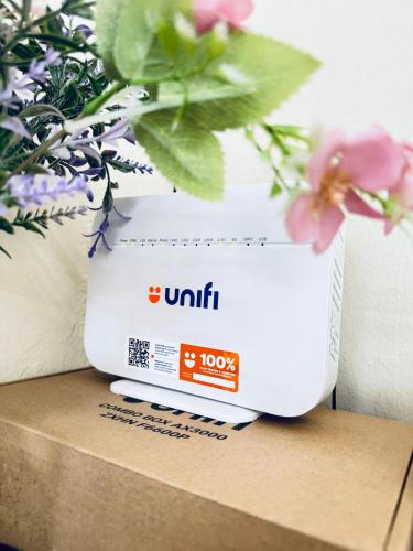 a box sitting on a table with flowers at Rosali Homestay in Melaka