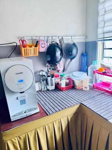 a laptop computer sitting on top of a counter at Rosali Homestay in Melaka