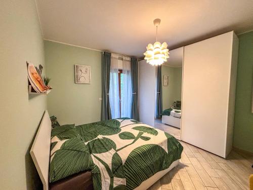 a bedroom with a bed and a chandelier at Guest house zona Università - Ospedale in Chieti