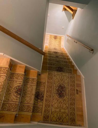 an image of a staircase with a tile floor at Spacious 3-Bedroom Family Home in Oxford in Oxford