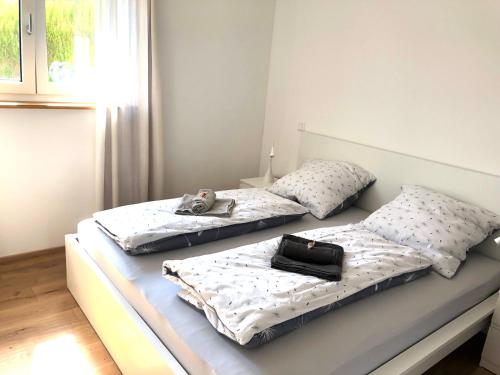 two beds sitting next to each other in a room at Pusteblume in Oberreute