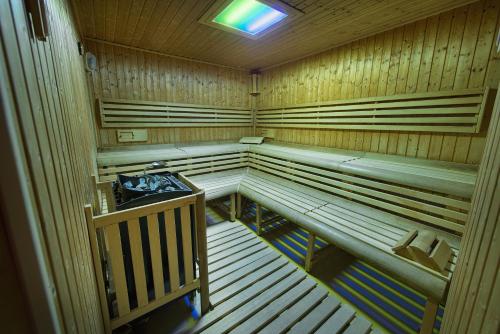 an inside view of a sauna with wooden walls at Wellness Hotel Diamant in Hluboká nad Vltavou