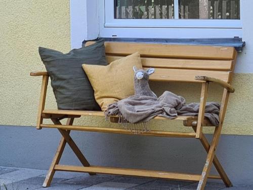 a bench with a stuffed animal sitting on it at Haus Waldstein Gipfelstürmer in Weißenstadt