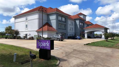 a large building with a sign in front of it at Spark by Hilton Brandon in Brandon