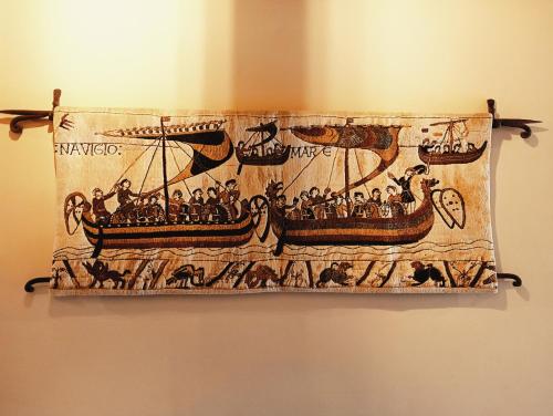 a tapestry of a ship on a wall at Le Mirage in Chieti
