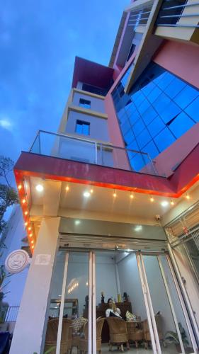 a building with lights on the front of it at Verve Nepal's Hostel in Kathmandu