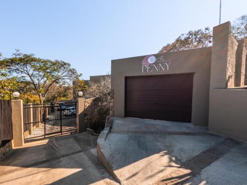 a garage door with a parking sign on it at 8 On Penny Guesthouse in Nelspruit