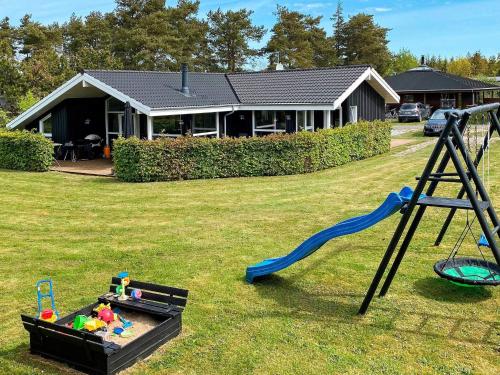 a yard with a playground with a slide and a playset at Spacious Family Retreat - By Traum Ferienwohnungen in Hals
