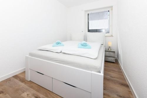 Postel nebo postele na pokoji v ubytování Seekieker - Nordseewelle