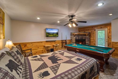 a bedroom with a pool table in a room at Simply Heaven in the Smokies By Avada Properties in Wear Valley
