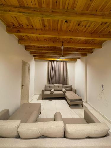 a living room with a couch and a table at Luxor Thames apartment in Luxor