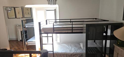 a room with three bunk beds in a room at Villa Nanou Riviera in Nice