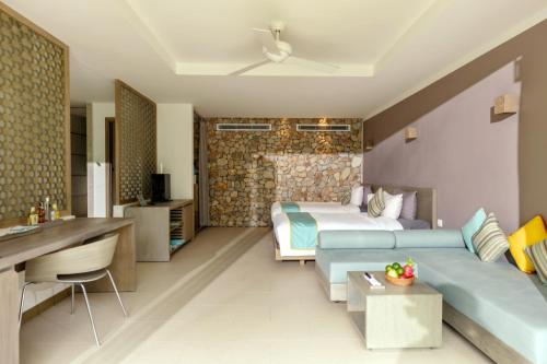 a hotel room with two beds and a kitchen at Mia Resort Nha Trang in Nha Trang