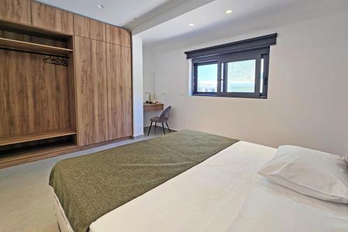 Ένα ή περισσότερα κρεβάτια σε δωμάτιο στο Ortus Luxury Residence
