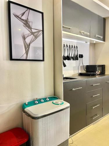 a kitchen with a table in the corner of a room at Kay cay luxury apartment in Lekki