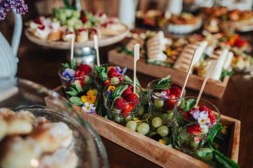 a table filled with plates of food with appetizers at Svatojakubský pivovar 