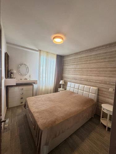 a bedroom with a large bed in a room at apartment in Kojori in Tbilisi City