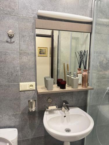 a bathroom with a sink and a mirror at apartment in Kojori in Tbilisi City