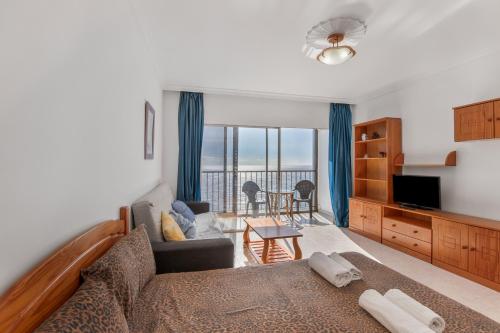 En eller flere senge i et værelse på Studio vista mar by masvacaciones