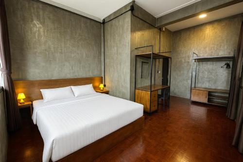 Ένα ή περισσότερα κρεβάτια σε δωμάτιο στο Lanna Loft Hostel