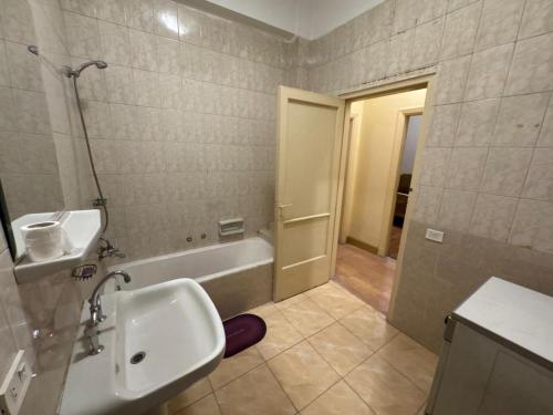 a bathroom with a sink and a bath tub at Prime location 2 bed rooms Apartment , near the Nile & Cairo Center in Cairo