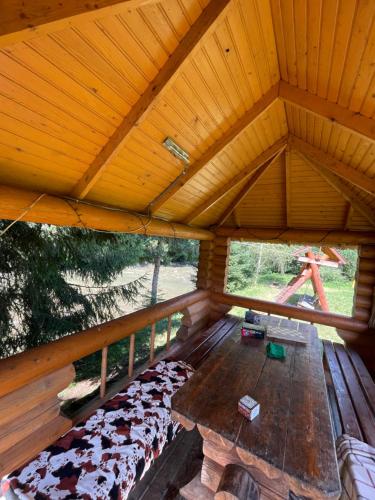 an overhead view of a porch with a wooden roof at Садиба Урочище Луг in Vorokhta