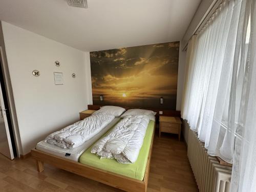 Cama o camas de una habitación en Bergnest Wildhaus