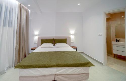 Ένα ή περισσότερα κρεβάτια σε δωμάτιο στο Ortus Luxury Residence