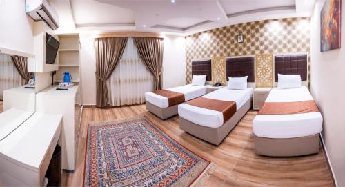 Katil atau katil-katil dalam bilik di Dur Kassir Alkadhimiya Hotel