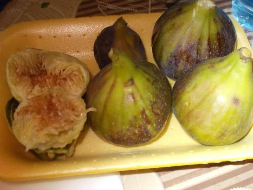 a yellow tray with cut up figs on it at Guesthouse Feel Lake in Virpazar