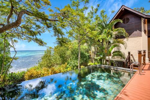 an infinity pool with the ocean in the background at JA Enchanted Island Resort Seychelles in Round Island