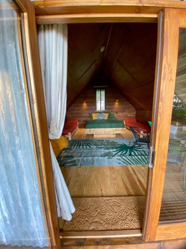 a view of a bedroom through a glass door at The Tin Tent in Kings Lynn