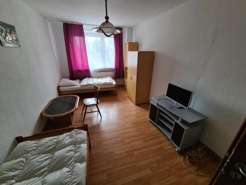TV a/nebo společenská místnost v ubytování Privatzimmer in Schalke Nord private room for you