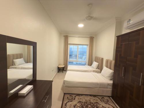 Кровать или кровати в номере Salalah golden villa