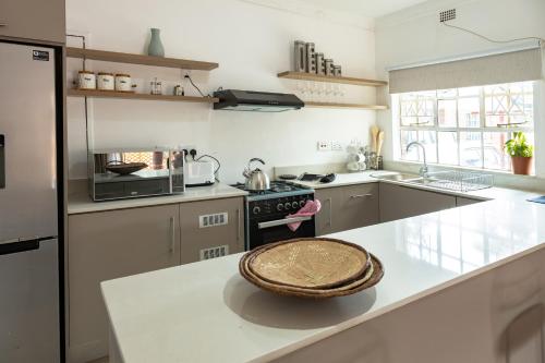 a kitchen with a counter with a bowl on it at 2-Bed Cottage in Mount Pleasant, Harare in Harare