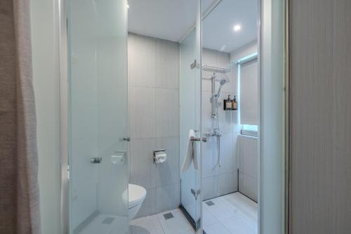 a bathroom with a shower and a toilet at Retro Taichung in Taichung