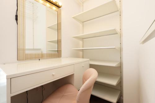 a bathroom with a white vanity and a mirror at Spacious 3 Bedroom Home in Heart Of Pontypool With Parking - By EKLIVING LUXE Short Lets & Serviced Accommodation in Griffithstown