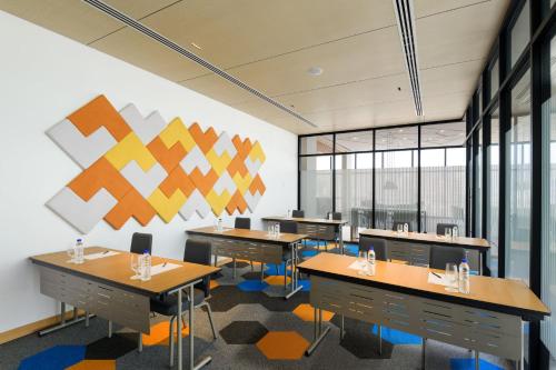 a classroom with desks and chairs in a building at OZO George Town Penang in George Town