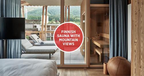 a hotel room with a sign that reads finish sauna with mountain views at Falkensteiner Hotel Kronplatz - The Leading Hotels of the World in Brunico