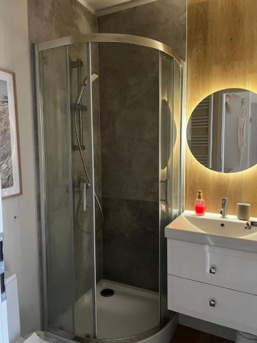 a bathroom with a shower and a sink at Apartament Boho Monte 60 in Sopot